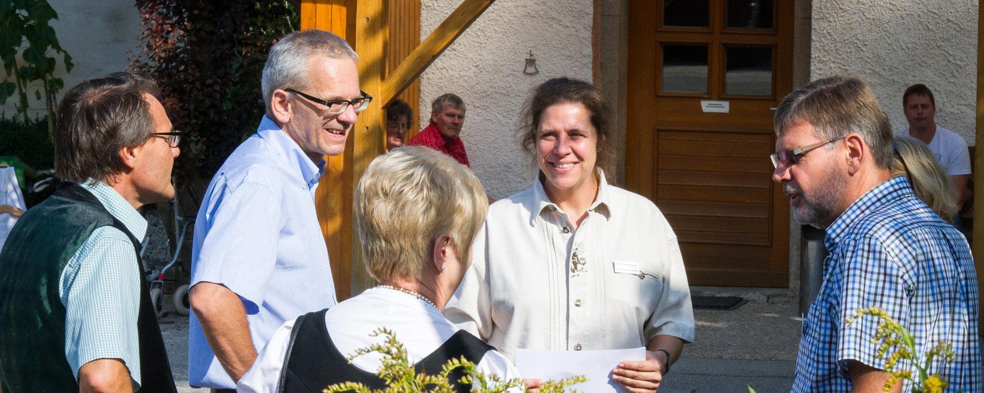 Teamleiter/innen im Gespräch mit Besuchern